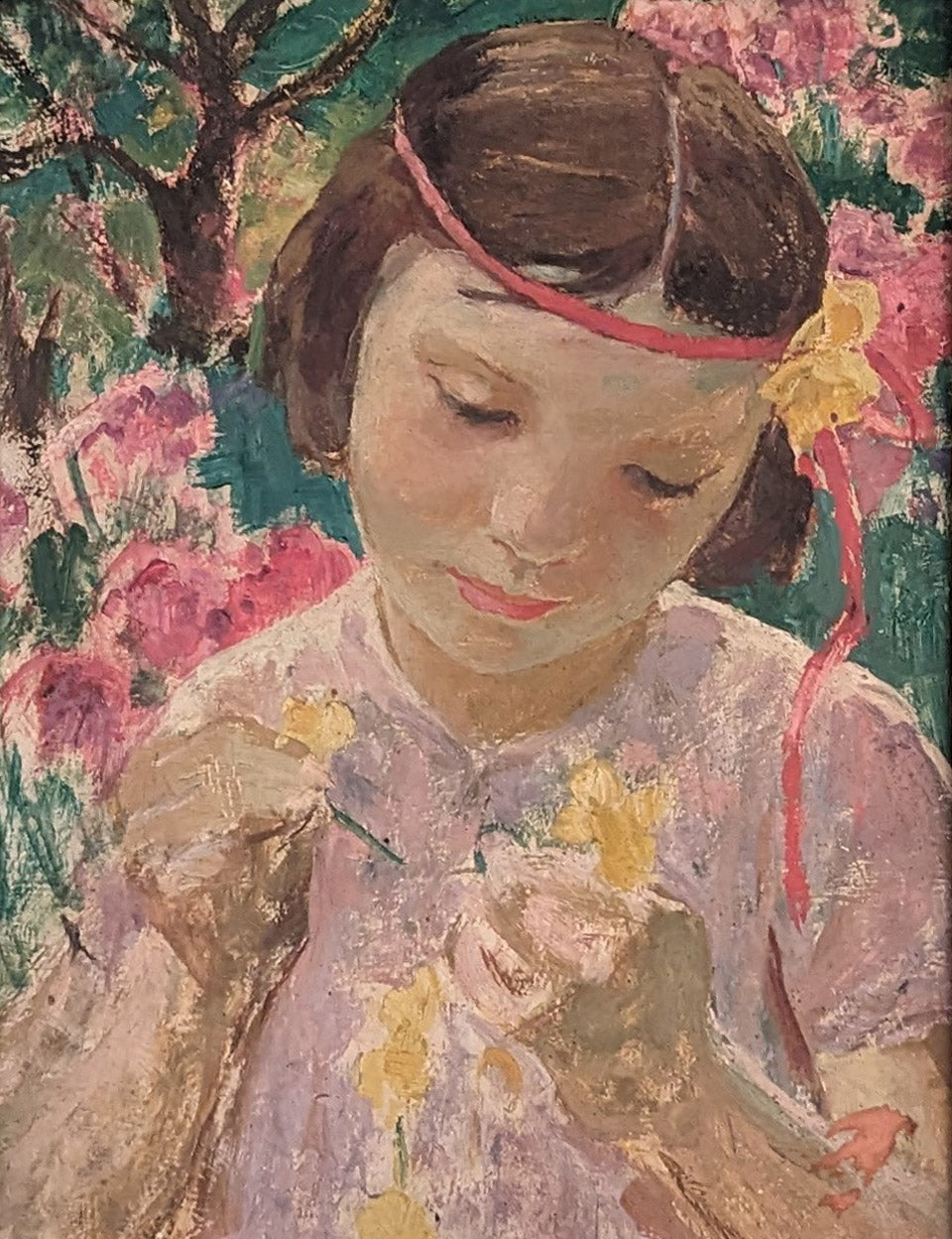 Young girl making a Buttercup chain